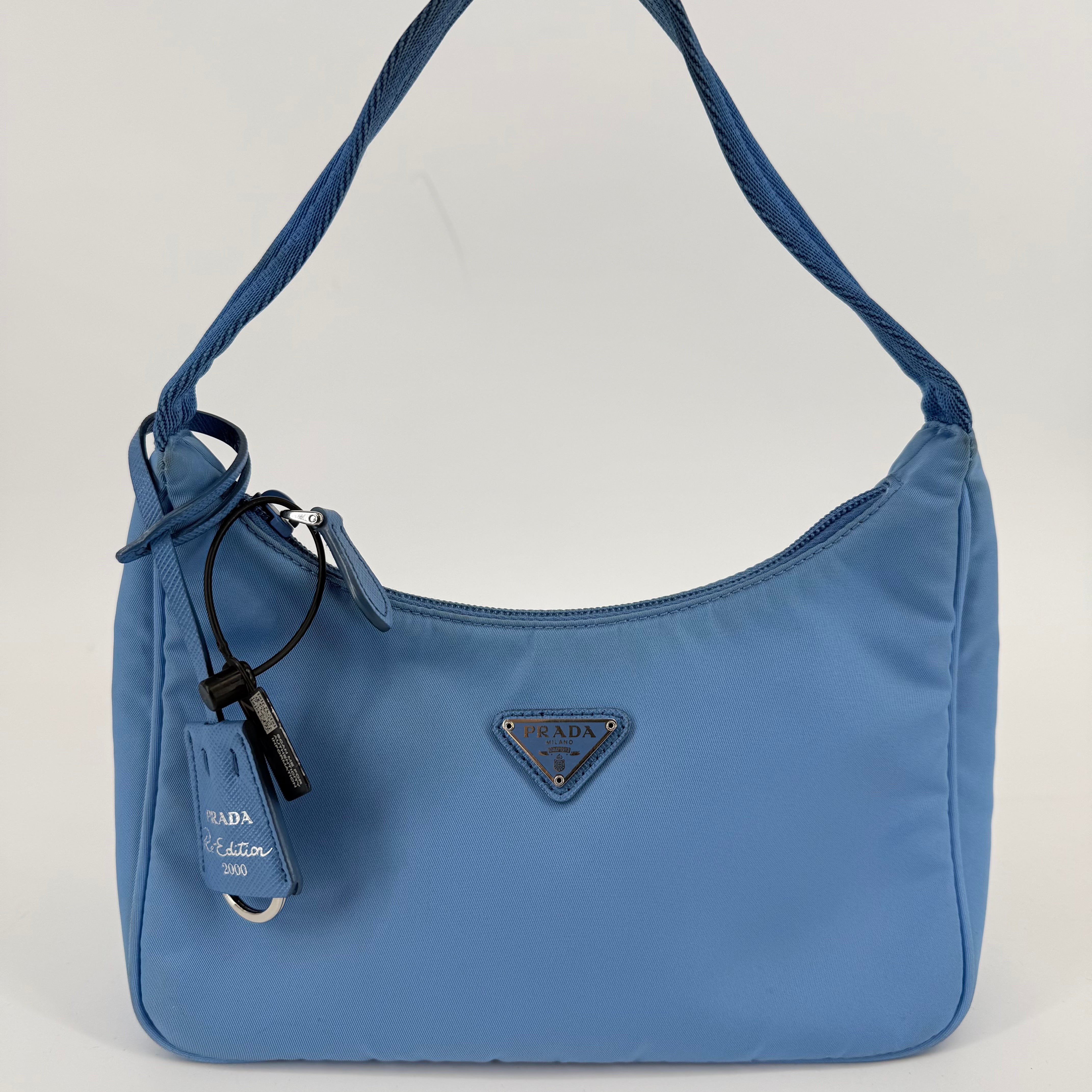 Prada Re-Edition Tessuto Mini Hobo Bag (L-383)